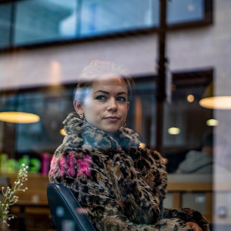 Kaveri Mehta, Lead Design Curator at Modern Connect System, reviewing corporate floral arrangements